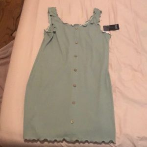 Sage green dress with false buttons and tags still intact